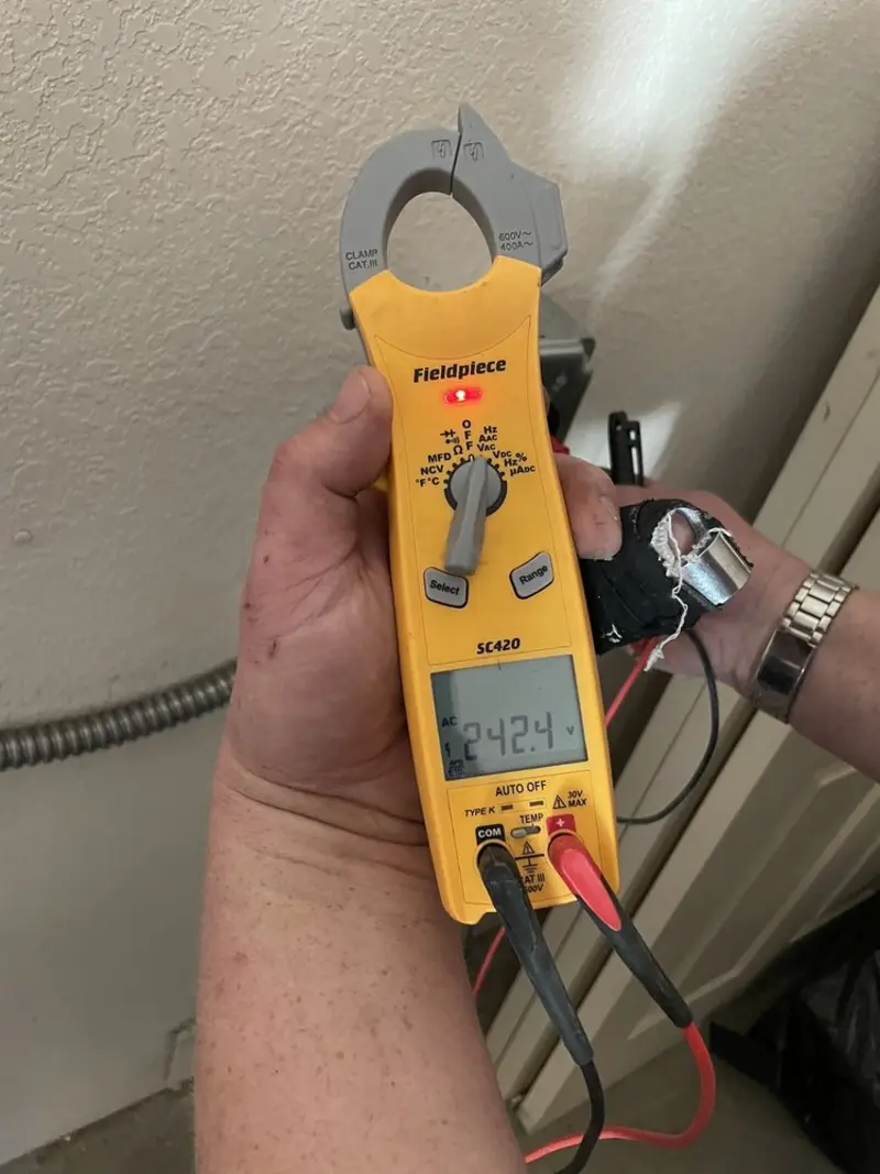 Voltage testing with clamp meter during Ceiling Fan Installation in Ladera Ranch